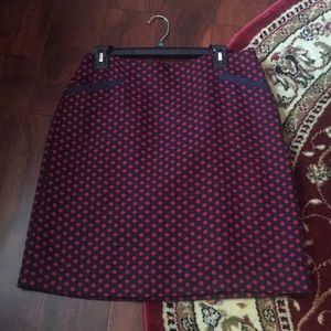 Cute dark blue and red dotted skirt with pockets.